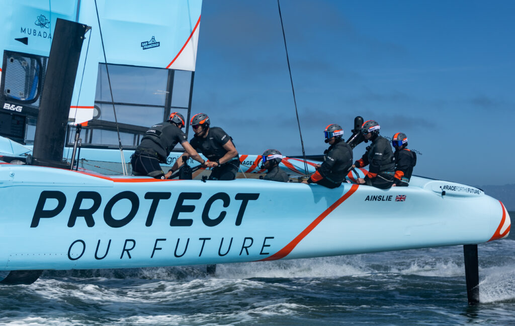Great Britain SailGP Team in action onboard their newly branded F50 catamaran along with Great Britain Inspire Racing x WASPZ sailor Hattie Rogers sitting behind Ben Ainslie during a practice session ahead of San Francisco SailGP, Season 2 in San Francisco, USA. 23rd March 2022. Photo: Jed Jacobsohn for SailGP. Handout image supplied by SailGP