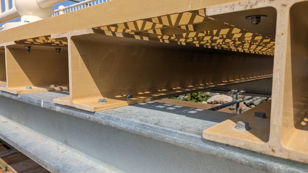 Dura Composites side view of sand coloured GRP pier in Wales