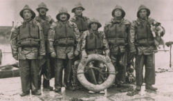 Ballycotton crew 1936. M.C. Walsh Mech. T Sliney, 2nd Cox, J.L.Walsh, J.S. Sliney. Cox Patrick Sliney, T D Walsh, W Sliney. and a dog.