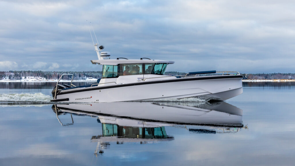 white 29ft hardtop cabin boat on the water