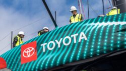 Emirates Team New Zealand new AC75 is rolled out of the shed for the first time in preparation for commissioning.