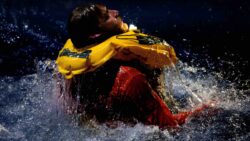 person in distres in water with a lifejacket on