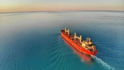 Cargo ship on open ocean.
