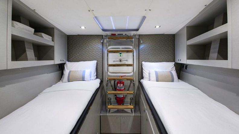 crew berth on Mishi 88. Austere bunks separated by a fire extinguisher