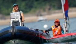 two girls on the water. One helming a RIB boat, one in a dinghy