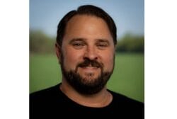 Dark haired guy with black t shirt Ian Smith